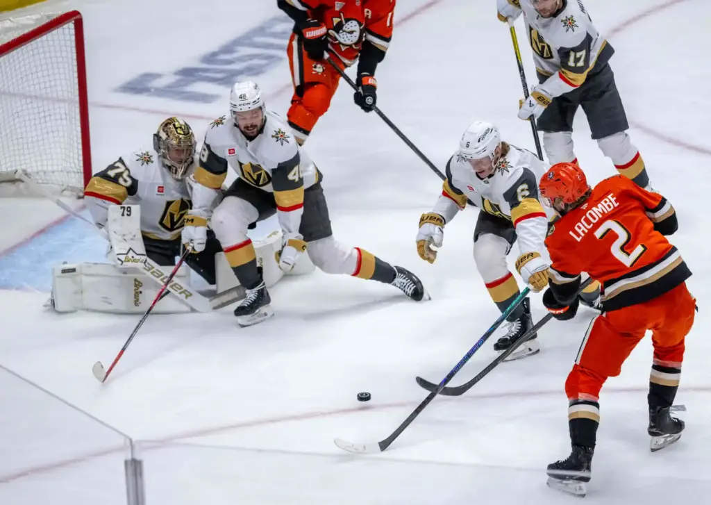 The Ducksâ Jackson LaCombe (2) shoots the puck as the...