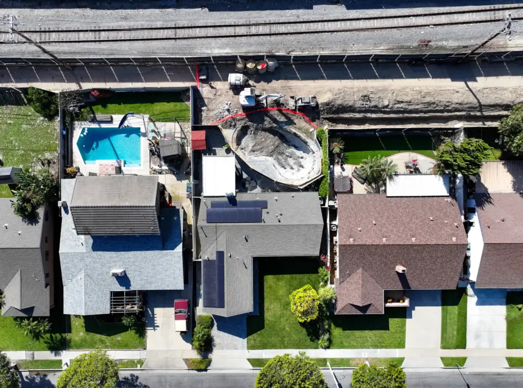 OC Sanitation crews are demolishing a backyard pool in the...