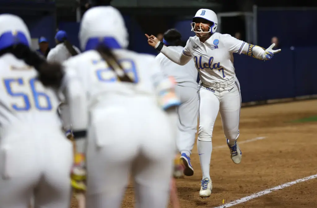 UCLAâs Jolyna Lamar (7) celebrates as she runs down the...