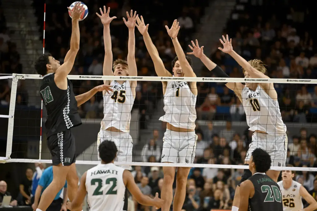 Hawaiiâs Kristian Titriyski spikes the ball against Long Beach State...
