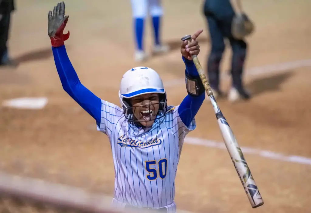 La Mirada outfielder Alanna Adams celebrates scoring a run in...