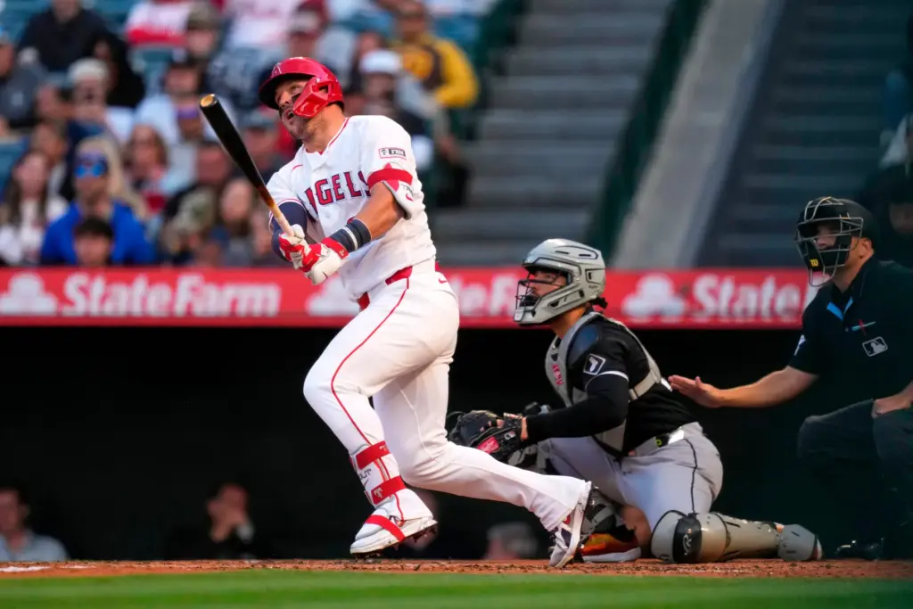Angels star Mike Trout watches the flight of his solo...