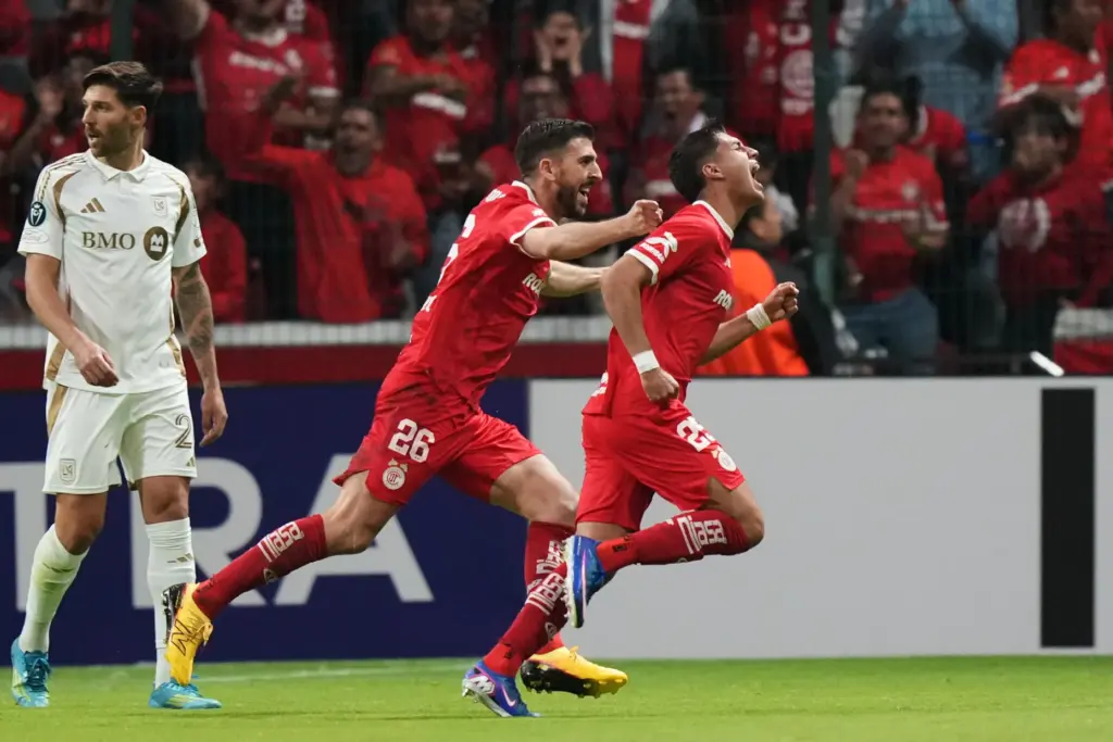 Toluca FC’s Everardo Lopez, right, celebrates after scoring to give...
