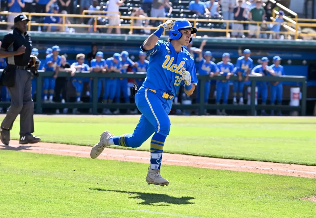 Mulivai Levu #39 of the UCLA Bruins reacts after hitting...