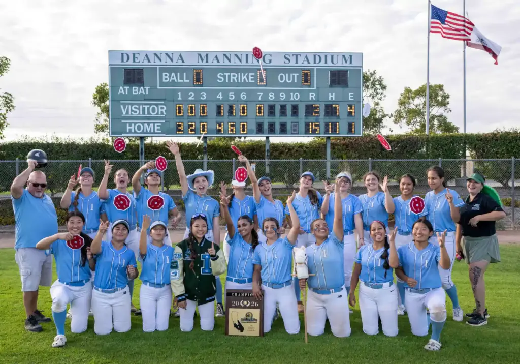 Irvine players and coaches toss their CIF championship patches in...
