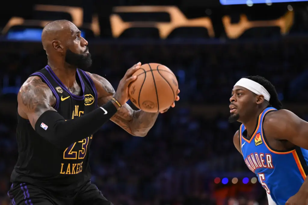 Lakers star LeBron James looks to shoot as the Oklahoma...