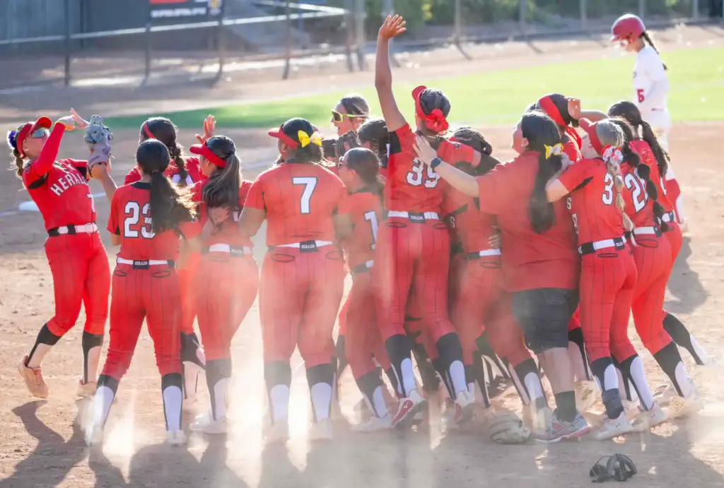 Whittier Christian players celebrate their 5-3 win over Mater Dei...