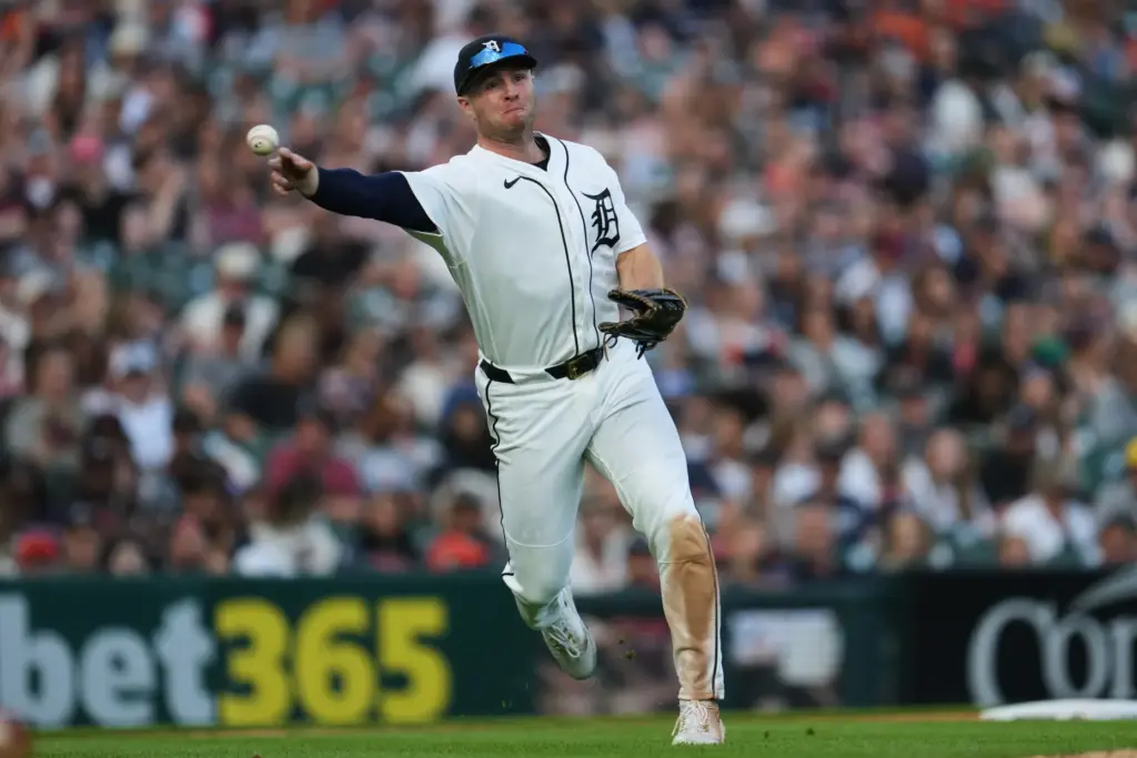 Detroit Tigers third baseman Colt Keith throws to first base...