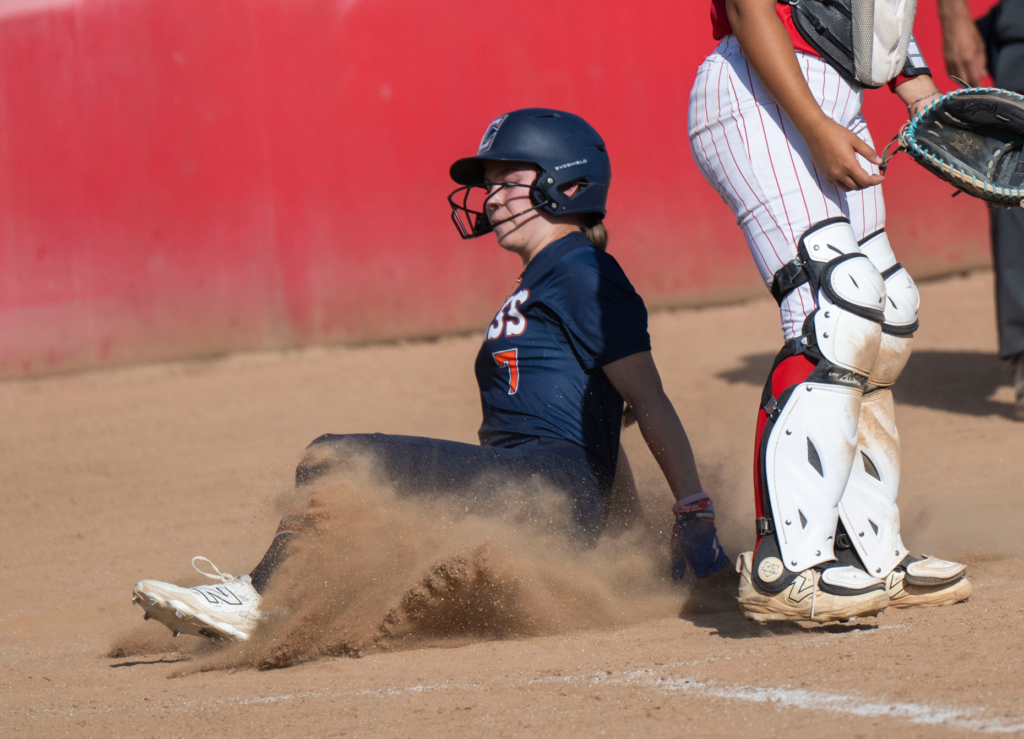 Cypress’ Emiko Saunders scores a run against Fullerton in the...