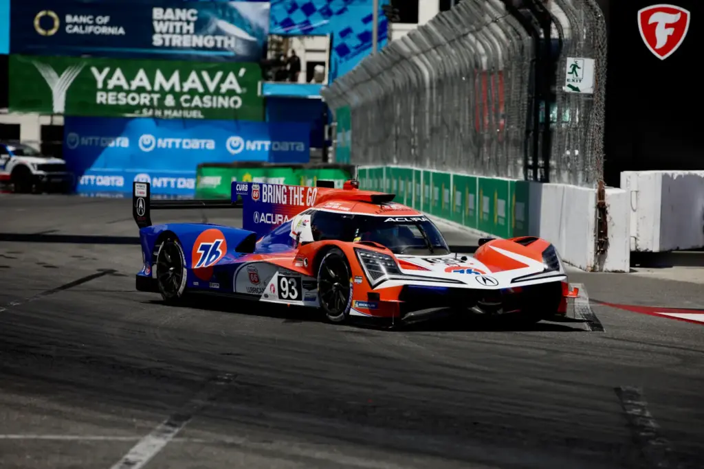 Eventual winner, the Acura Meyer Shank Racing team #93 heads...