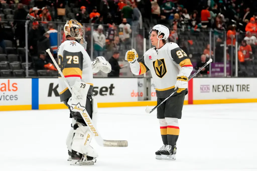 Vegas Golden Knights goaltender Carter Hart, left, and right wing...