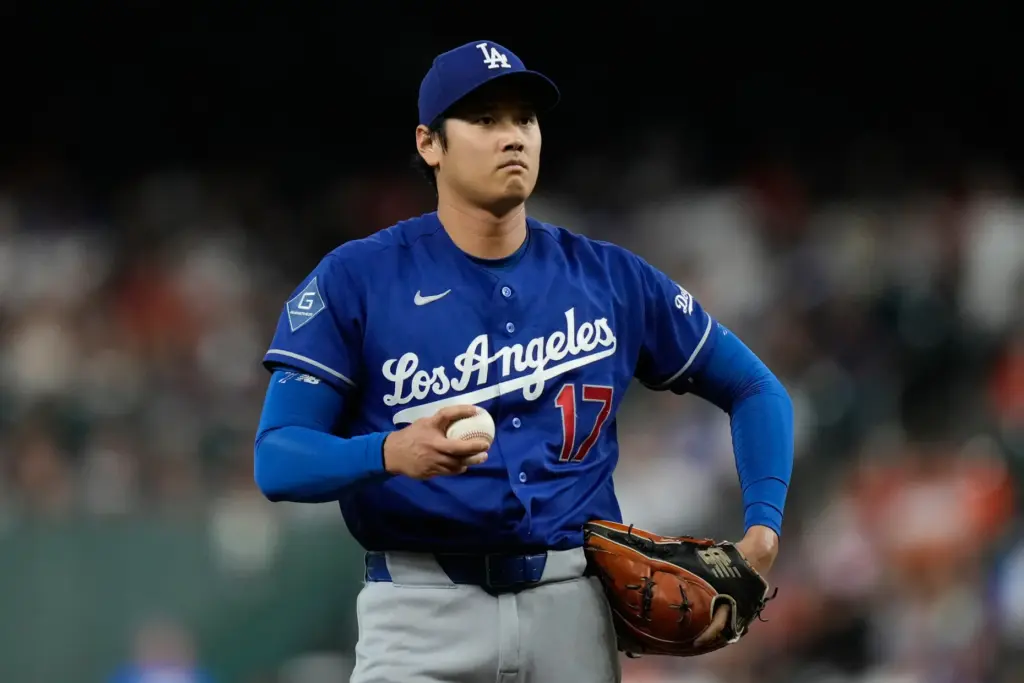 Dodgers starting pitcher Shohei Ohtani stands on the mound during...