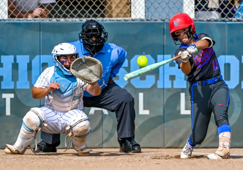 Los Alamitos outfielder Alivia Magallanes hits the ball during a...