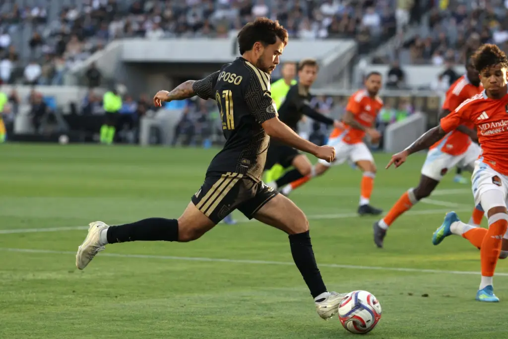 Los Angeles FC midfielder Ryan Raposo moves the ball against...