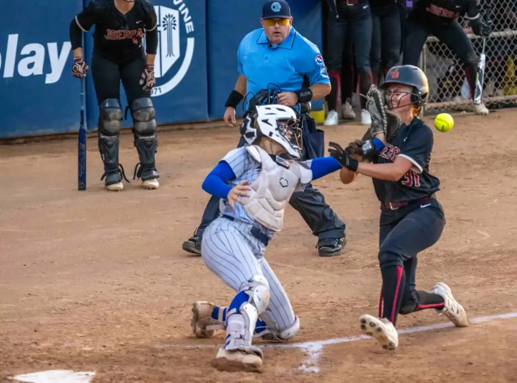 JSerra third baseman Ava Van Heerde gets hit with the...