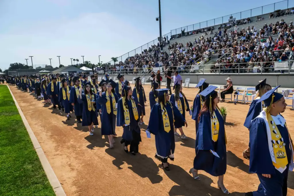 Graduates enter Handel Stadium during the Anaheim High School graduation...