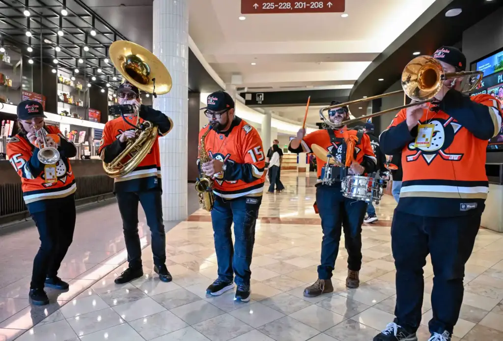 Members of Bear Brass perform for fans on their way...