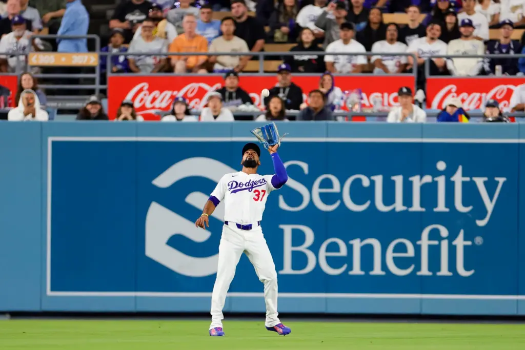 Dodgers left fielder Teoscar Hernandez catches a fly ball hit...
