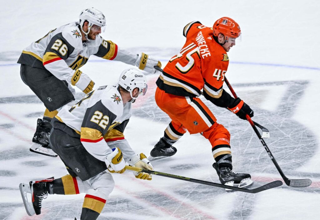 The Ducksâ Beckett Sennecke (45) controls the puck during the...