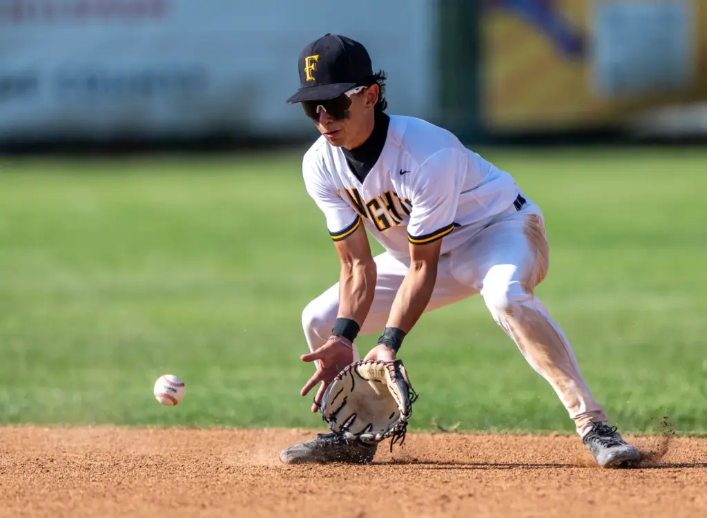 Foothill shortstop Jason Gugino fields the ball during a CIF-SS...