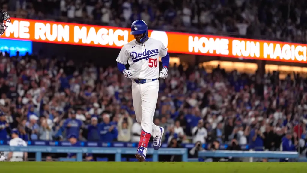 The Dodgers’ Mookie Betts trots home after hitting a three-run...