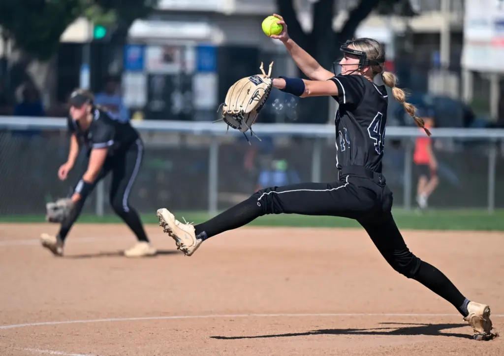 Pacifica relief pitcher Kenzie Bledl throws to home plate during...