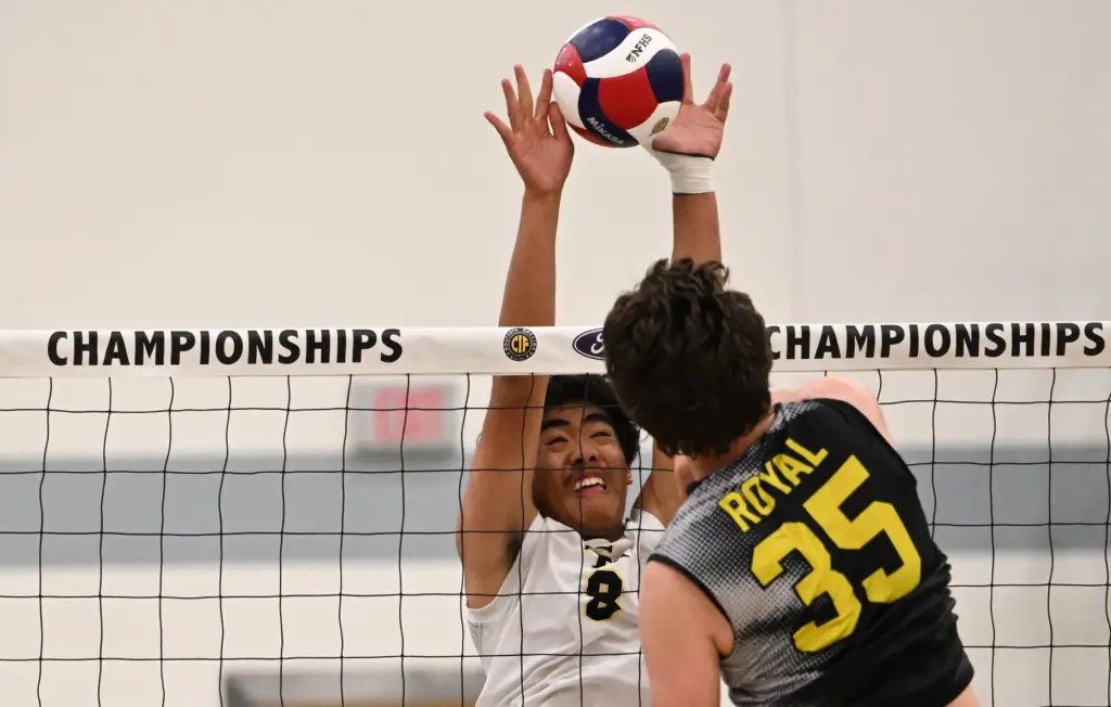 Jadyn Salud #8 of the Sunny Hills Lancers blocks a...