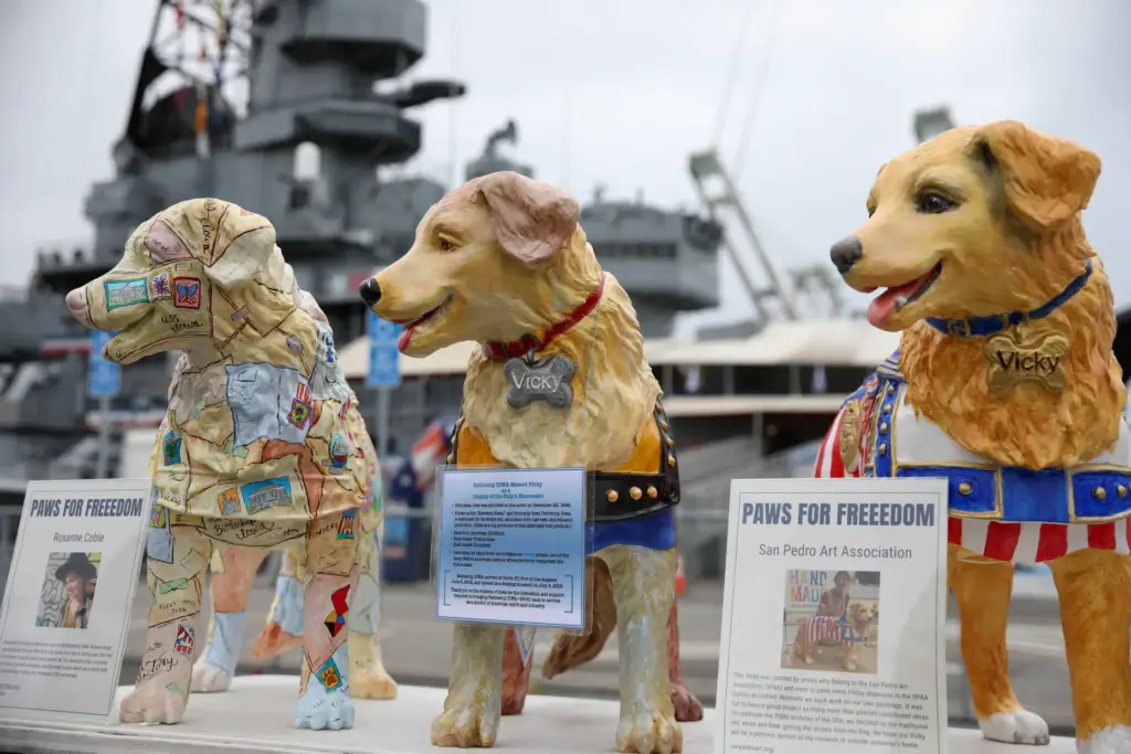 Statues of the USS Iowaâs mascot, Vicky the Dog, are...