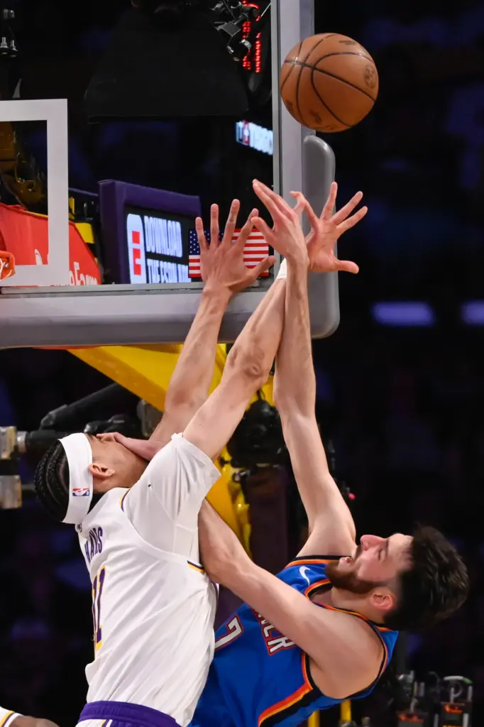 Lakers center Jaxson Hayes, left, fouls Oklahoma City Thunder forward...