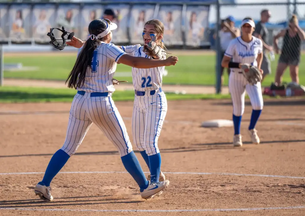 La Habra players celebrate their 11-8 victory over Orange Lutheran...