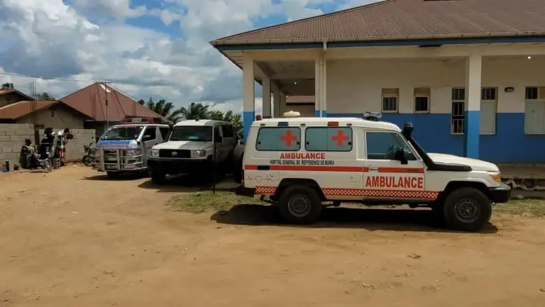 Ambulances are parked outside a hospital
