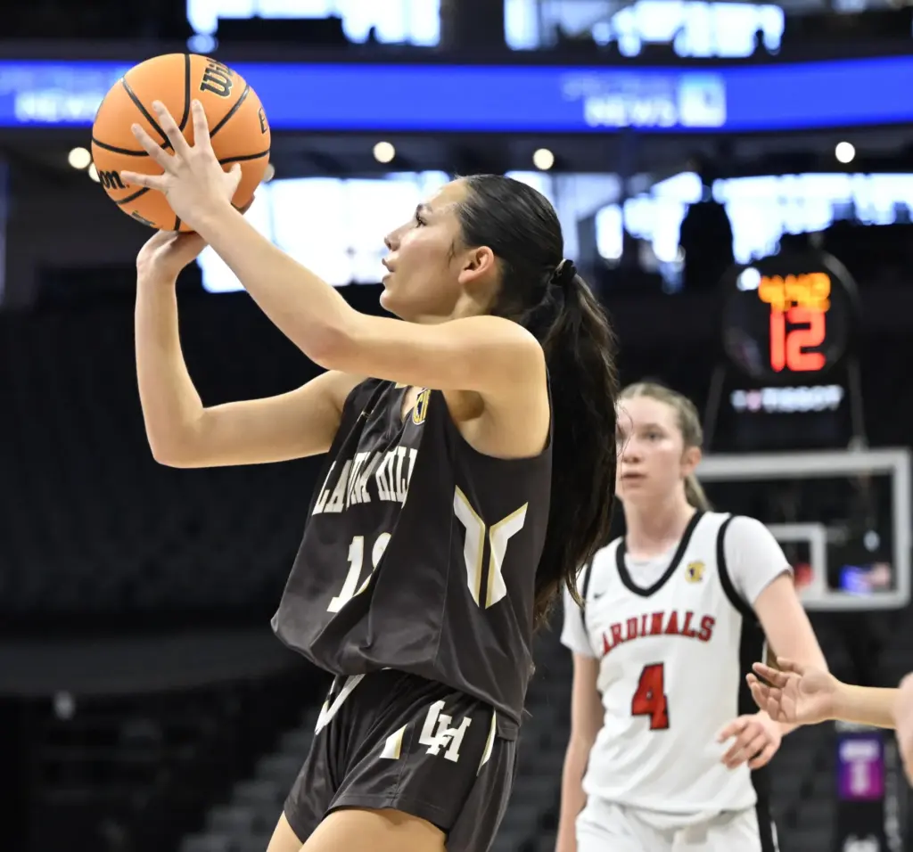 Lena Goodman #13 of Laguna Hills shoots past Sofia Sorbello...