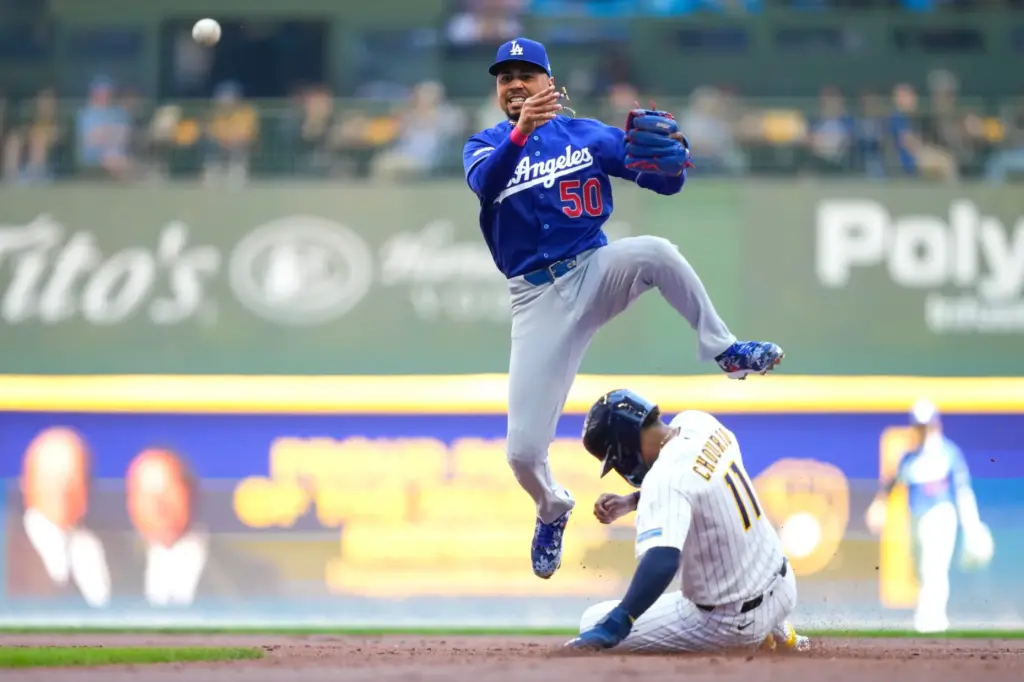 Dodgers shortstop Mookie Betts (50) makes a double play over...
