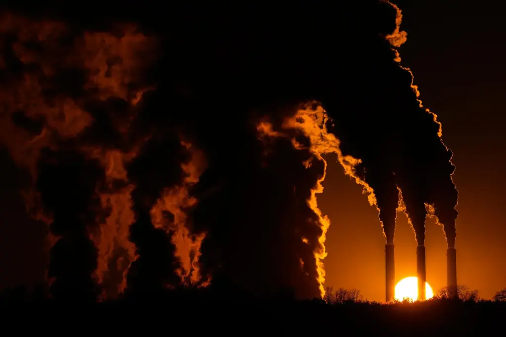 The Jeffrey Energy Center coal-fired power plant operates at sunset