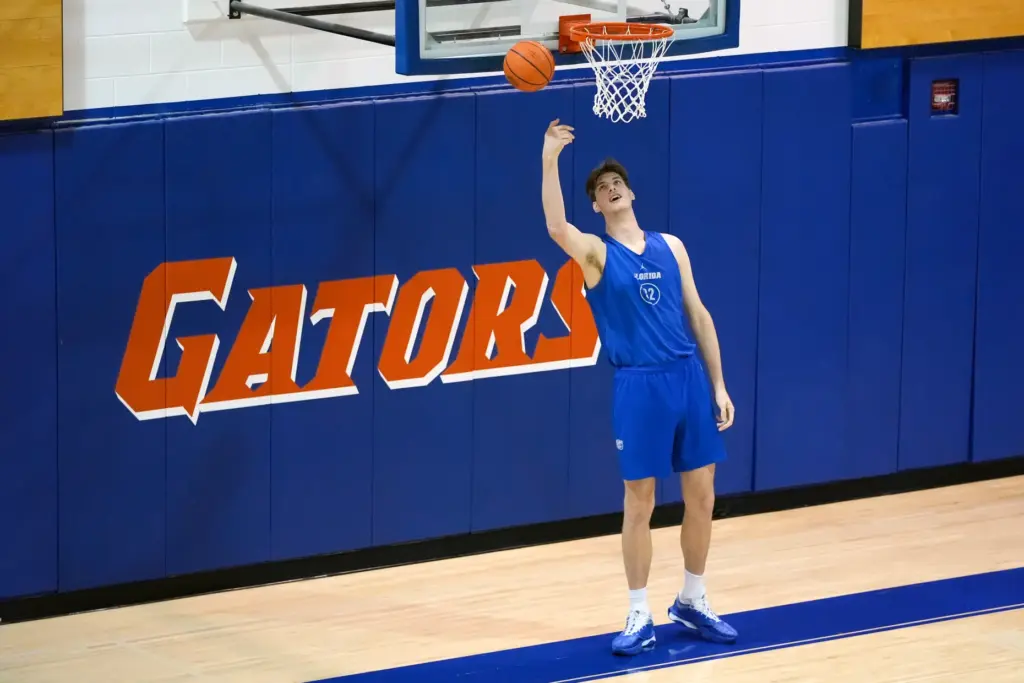 Olivier Rioux, a 7-foot-9 Florida player, practices with the team,...