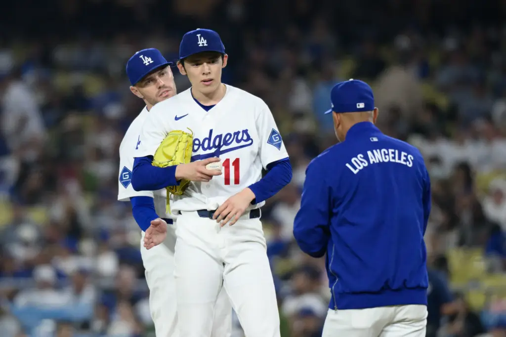 Dodgers starting pitcher Roki Sasaki (11) is removed from the...