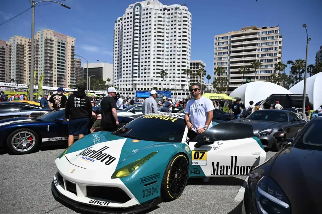 Rudy Celaya poses with his Marlboro Car during the Exotic...