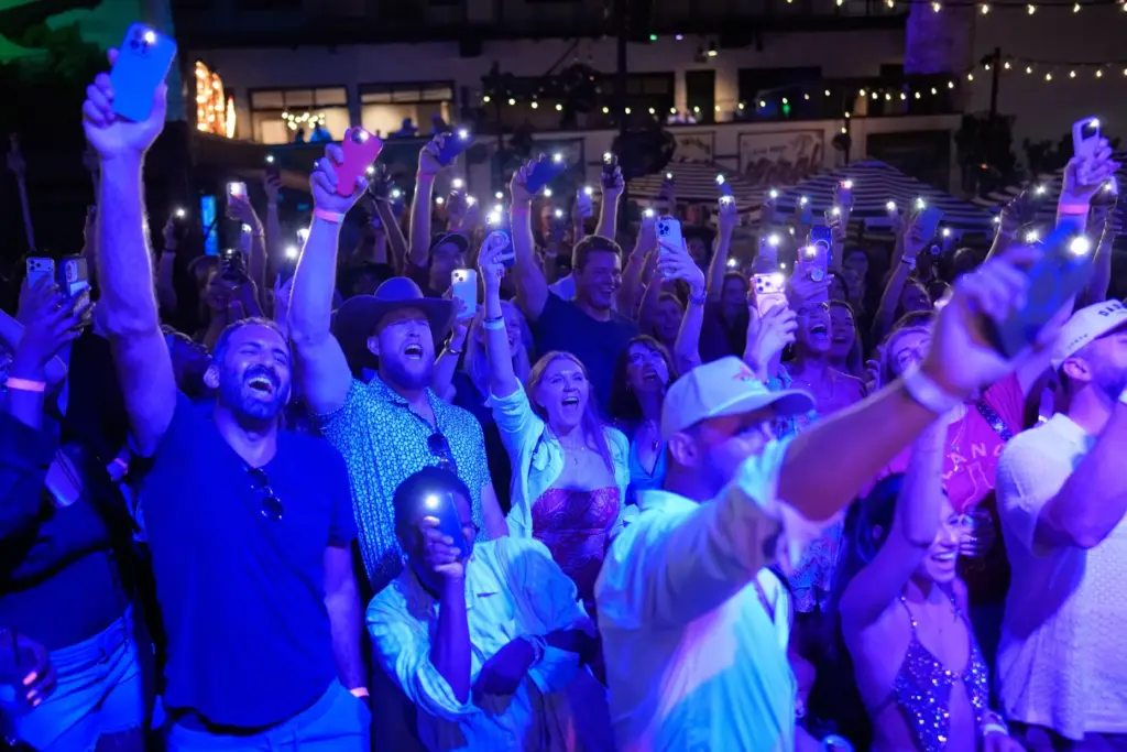 Attendees cheer during a Tall Tour event Saturday, May 9,...