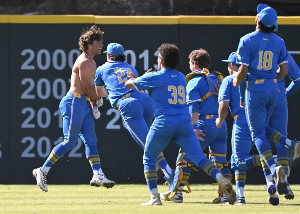Phoenix Call #4 of the UCLA Bruins is mobbed by...