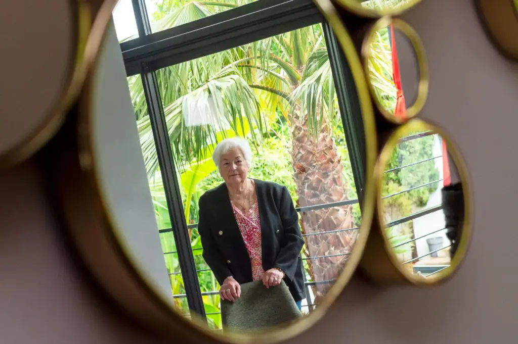 Marie-Therese Ross-Mahe, an 85-year-old French widow of a U.S. military veteran, poses in Orvault, France.