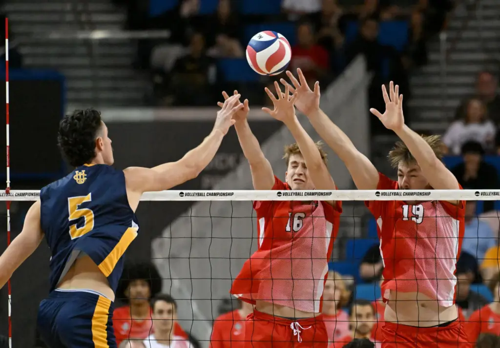UC Irvineâs William D’Arcy, left, sends the ball over the...