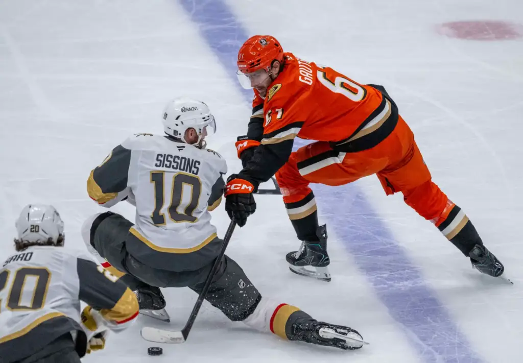 The Ducksâ Cutter Gauthier, right, controls the puck as the...