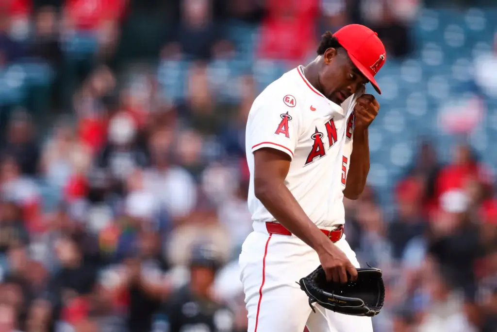 Angels pitcher JosÃ© Soriano wipes his face while walking to...