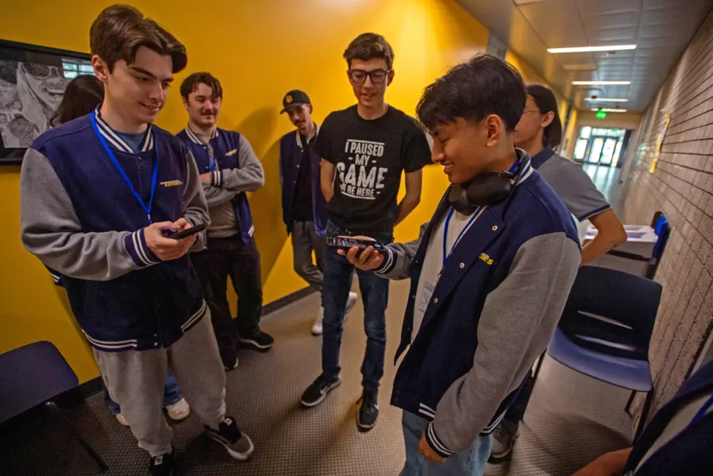Members of the Santiago Canyon Collegeâs esports club flip a...