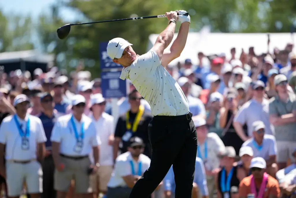 Rory McIlroy, of Northern Ireland, hits from the 16th tee...