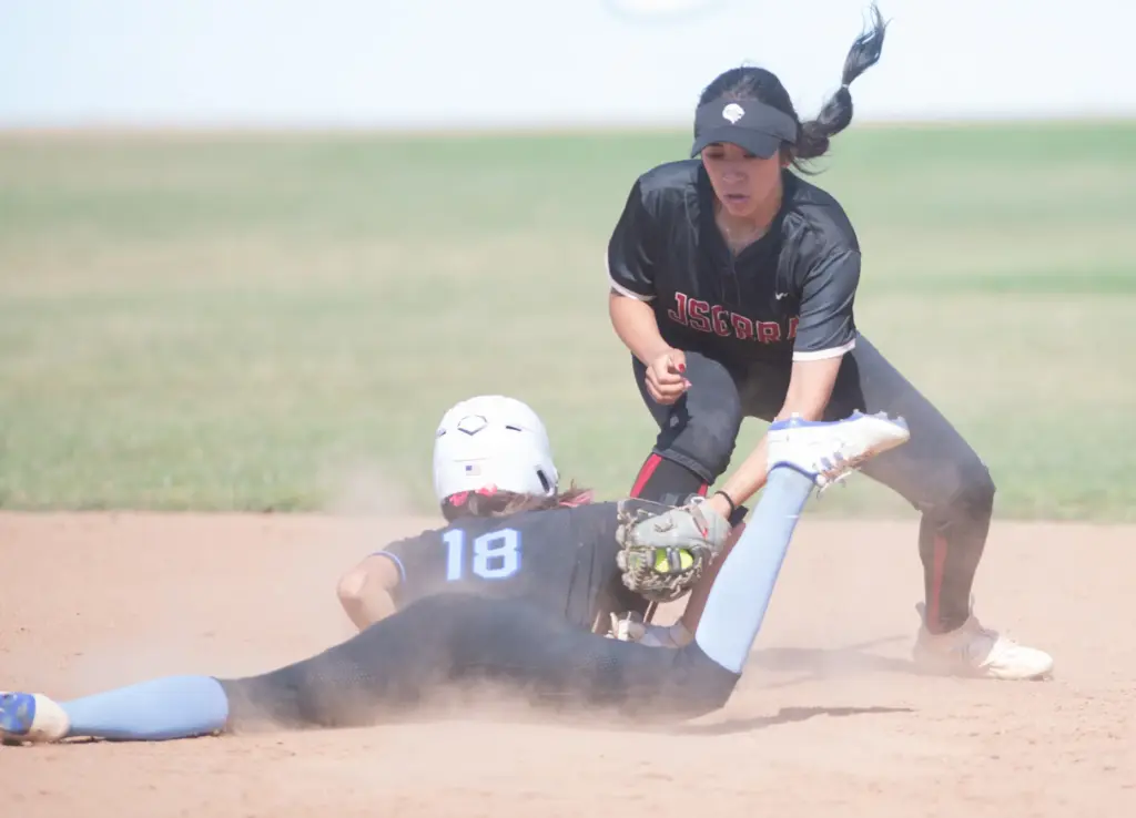 Norcoâs Kendra Nelsen, (#18), slides into second base safely as...