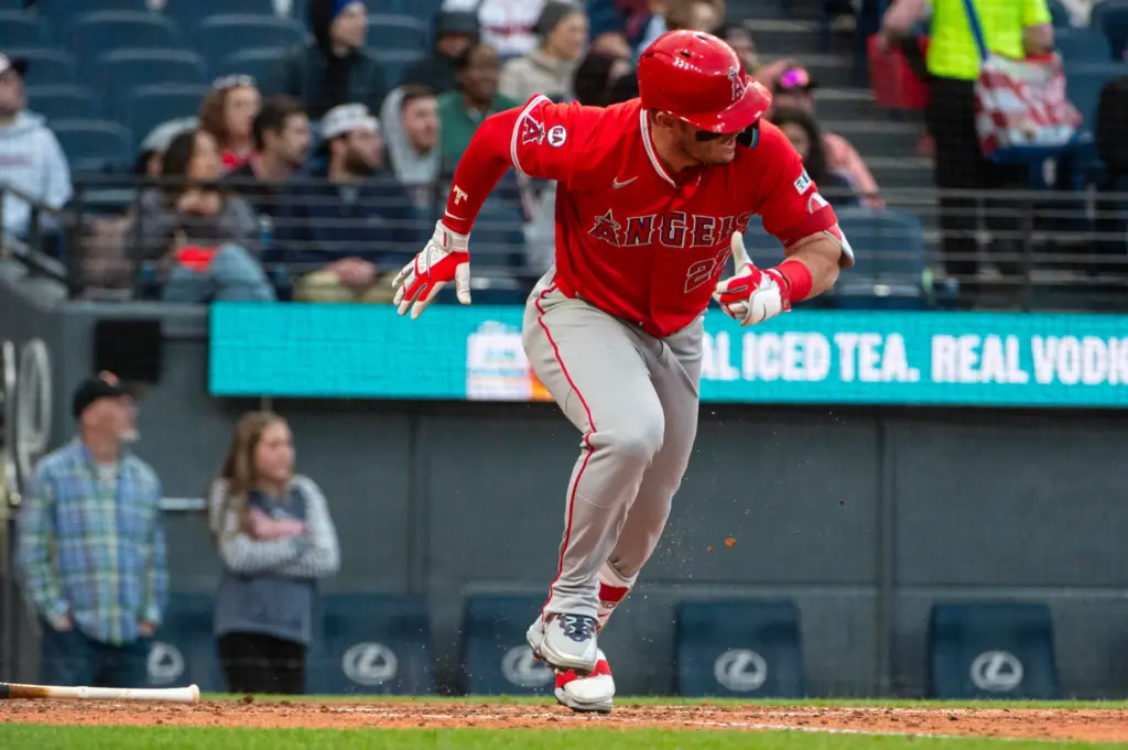 Angels star Mike Trout begins to run as he watches...