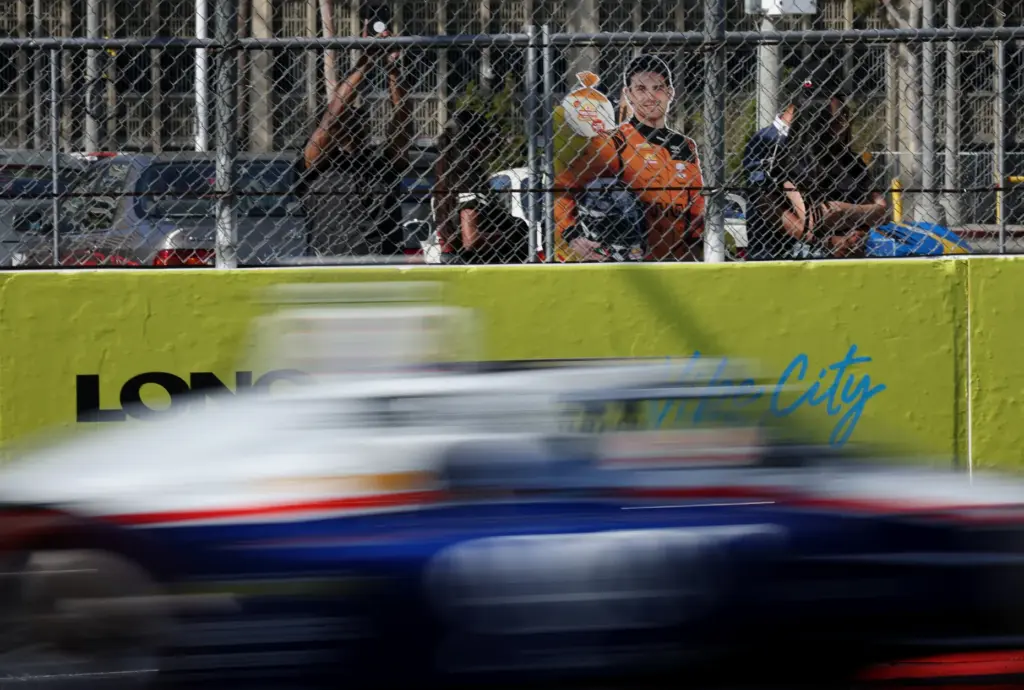 A cutout board of Indycar driver Pato OâWard rests against...