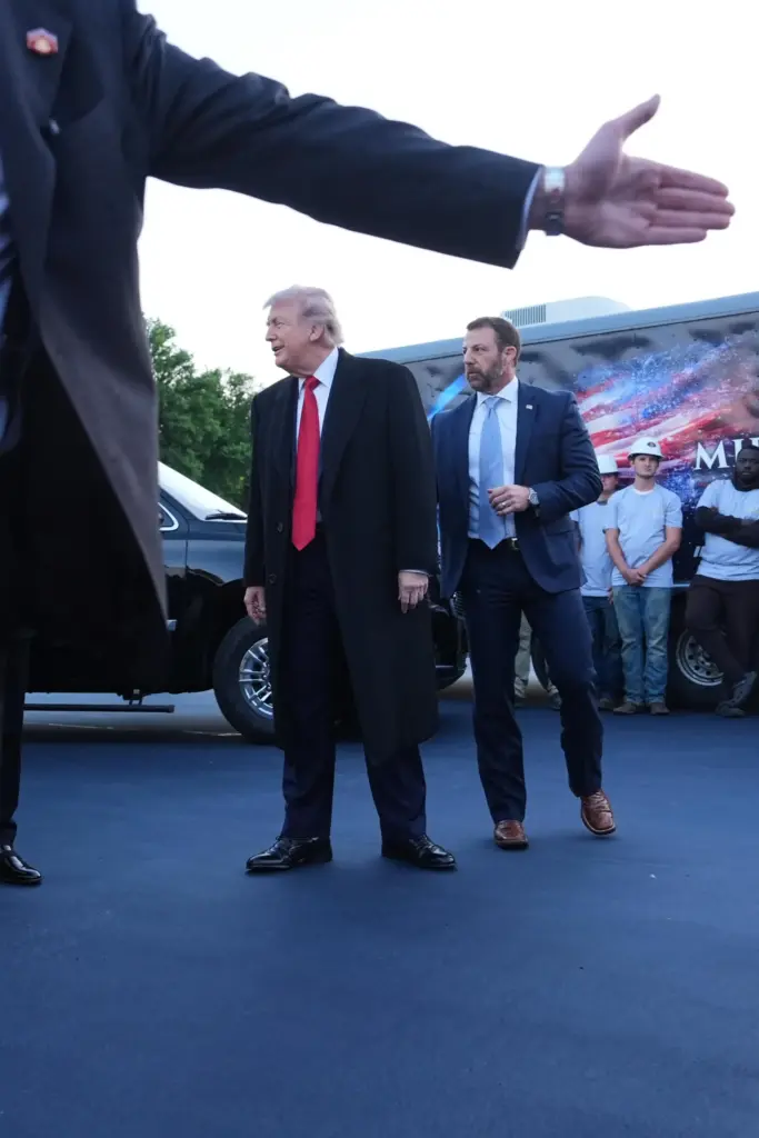 President Donald Trump talks as he visits the Lincoln Memorial Reflecting Pool.