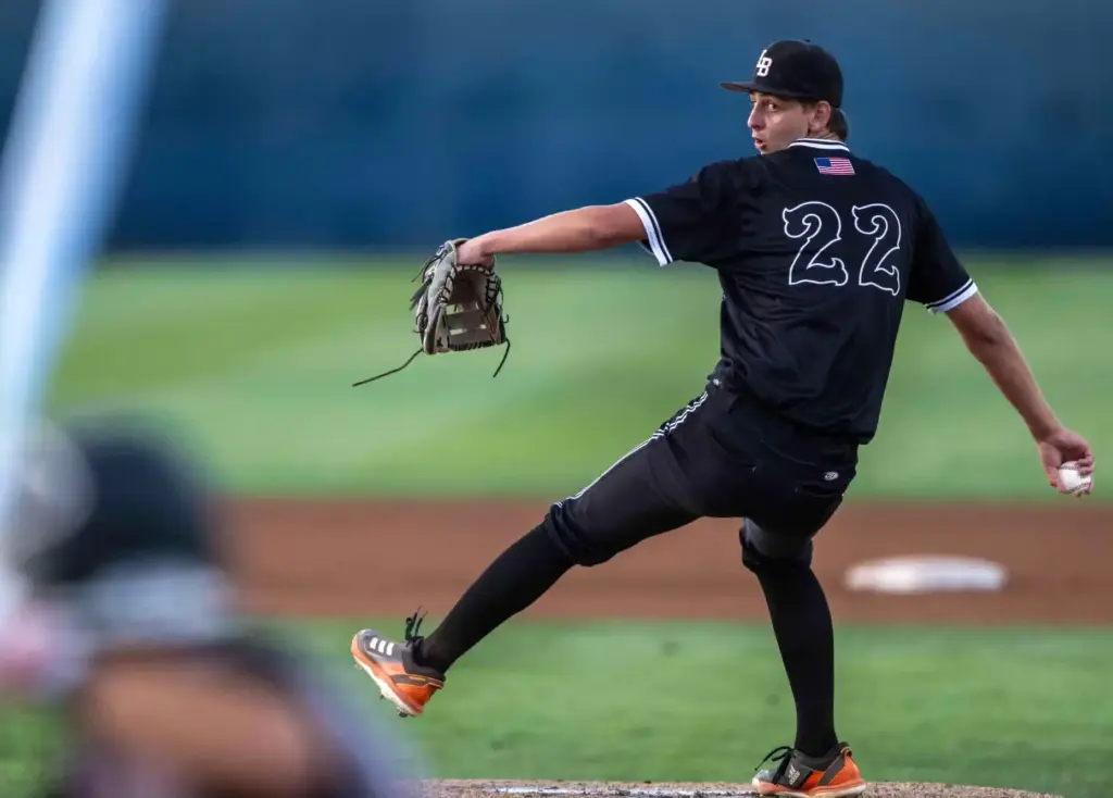 Laguna Beach starting pitcher Aaron Crosby throws to home plate...